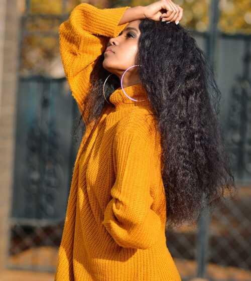 Woman wearing orange wool shirt